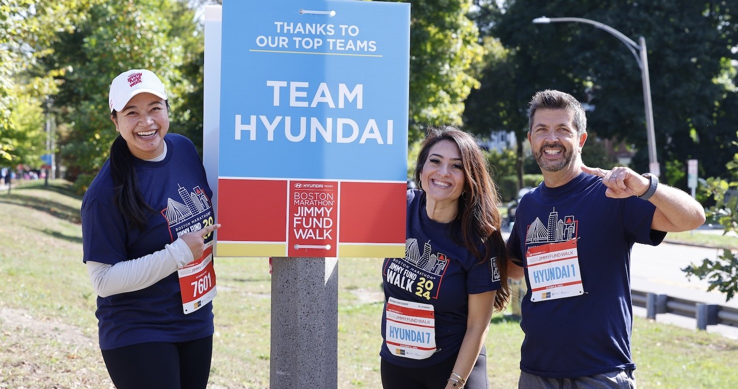 Jimmy Fund Walkers next to a Team Hyundai sign