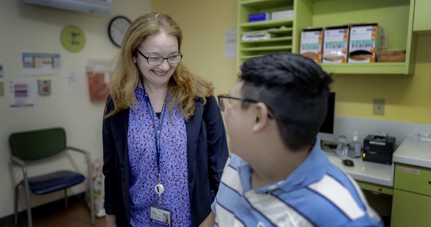 A Dana-Farber caregiver smiling with a patient