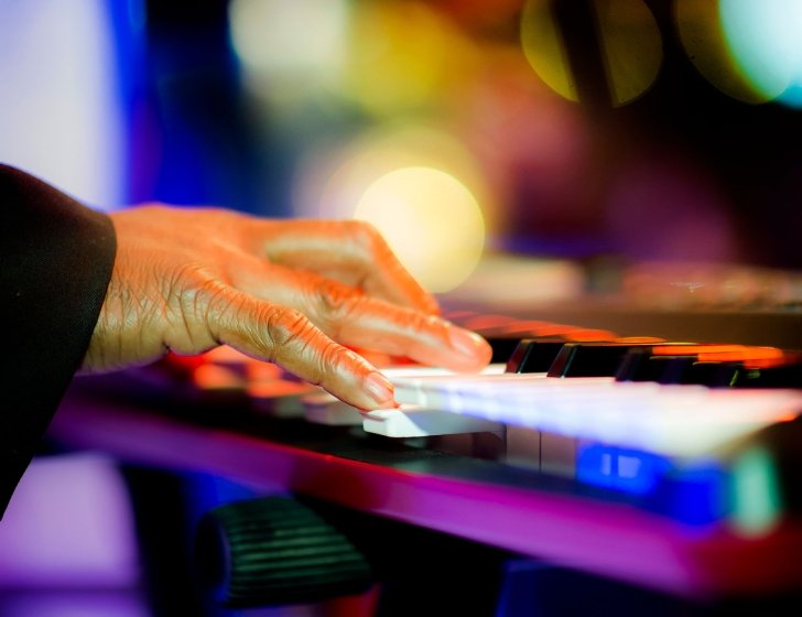 Close-up of someone playing a keyboard