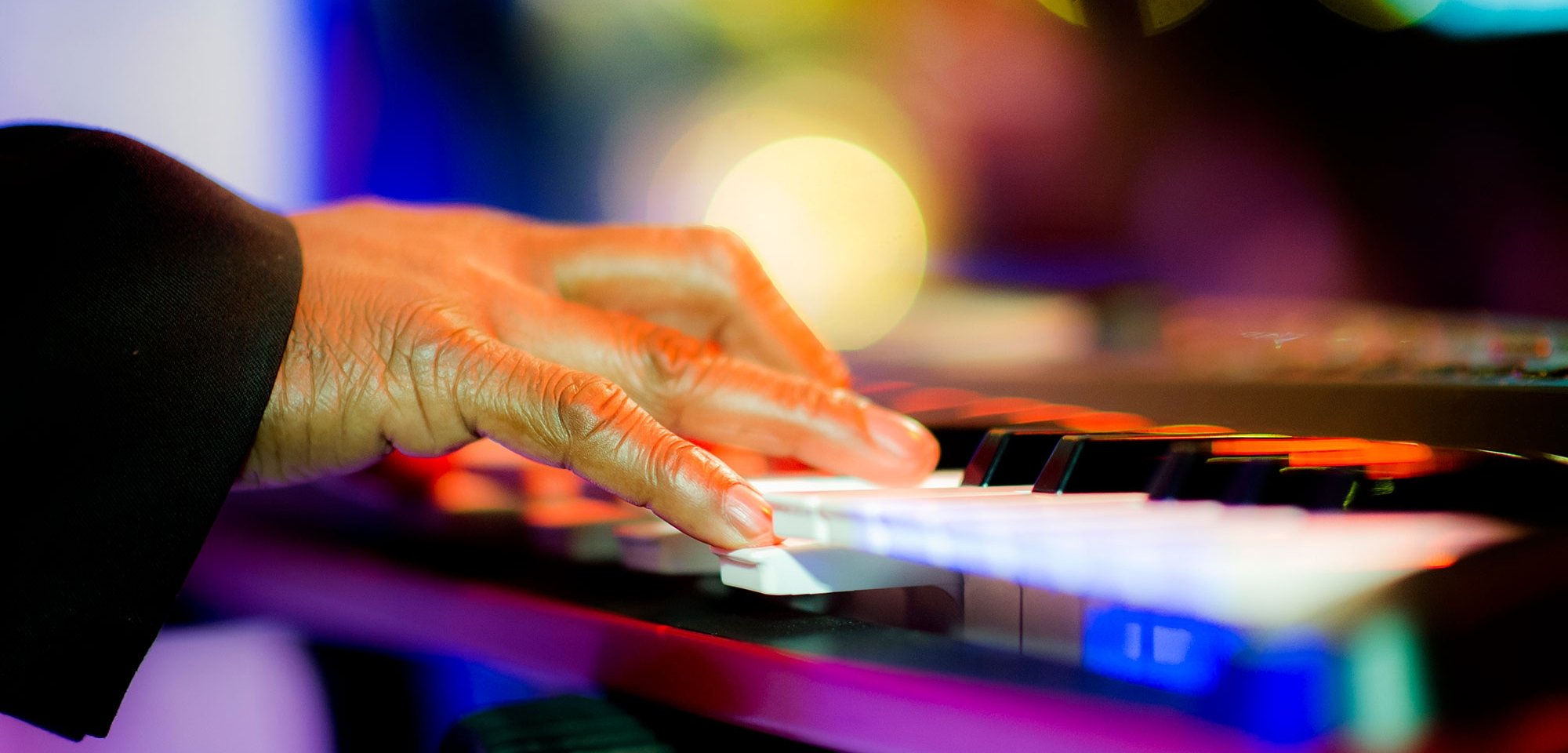 Close-up of someone playing a keyboard