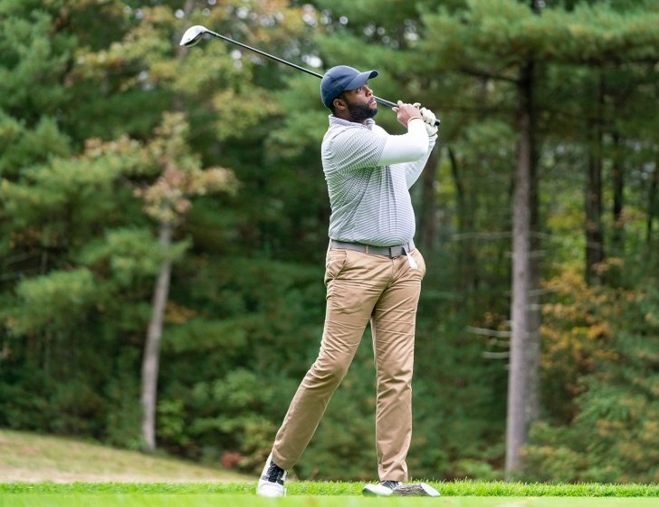 Golfer making a swing on a golf course
