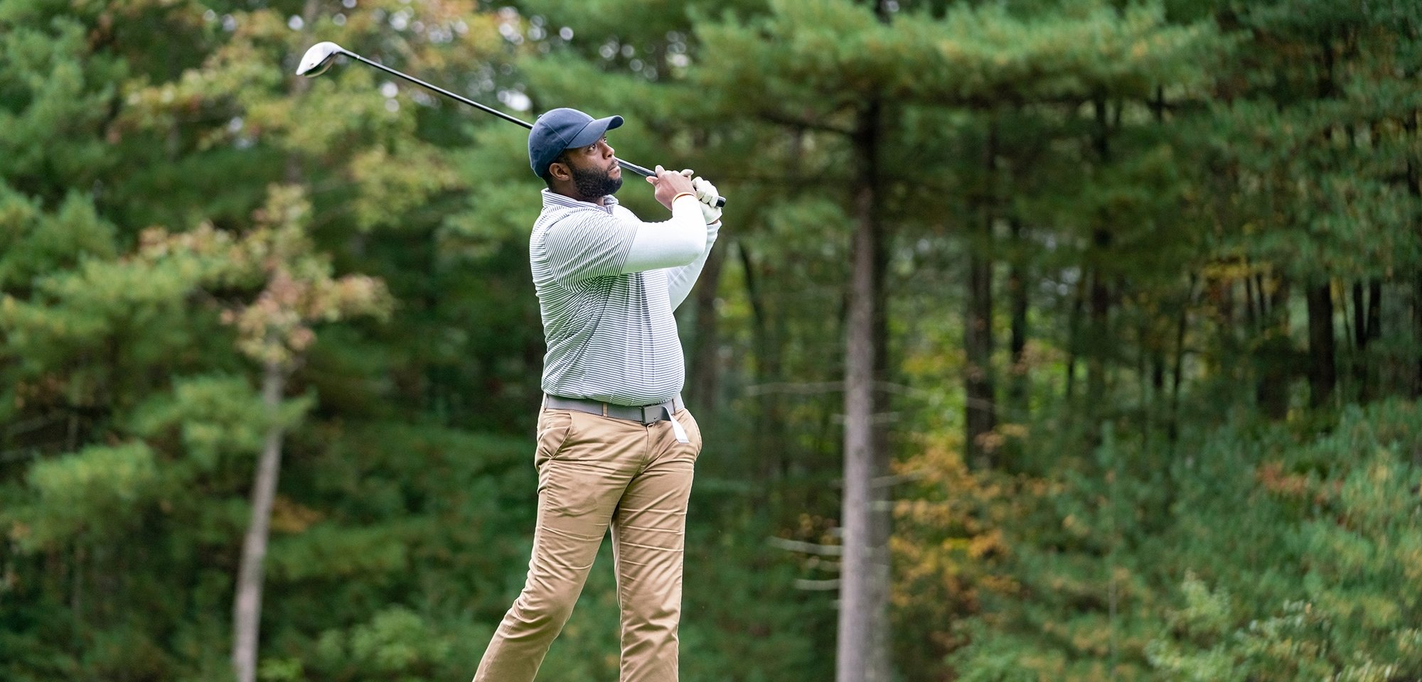 Golfer making a swing on a golf course