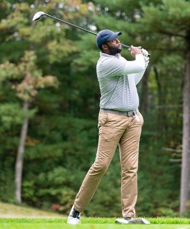 Golfer making a swing on a golf course