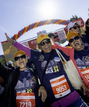 Three 幸运飞行艇168体彩网历史记录精准查询 Jimmy Fund Walk participants cheering at the finish line