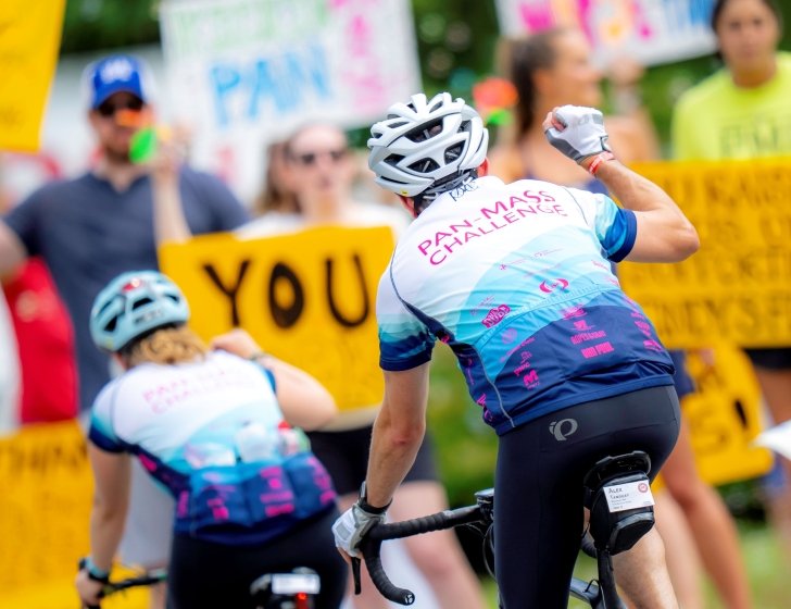 PMC riders bicycling on the road