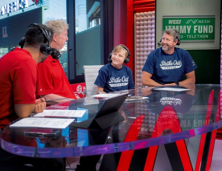 A Dana-Farber pediatric patient speaks with broadcasters at the WEEI/NESN Jimmy Fund Radio-Telethon