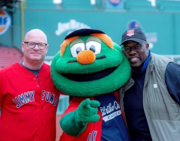Dana-Farber Cancer Institute supporters pose with Wally the Green Monster at Fenway Park