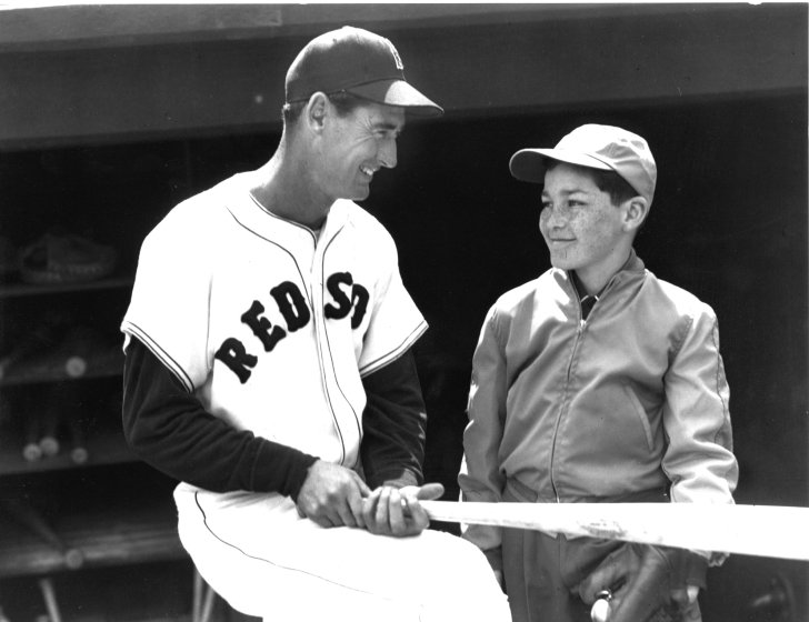 Black and white photo of Ted Williams with a patient