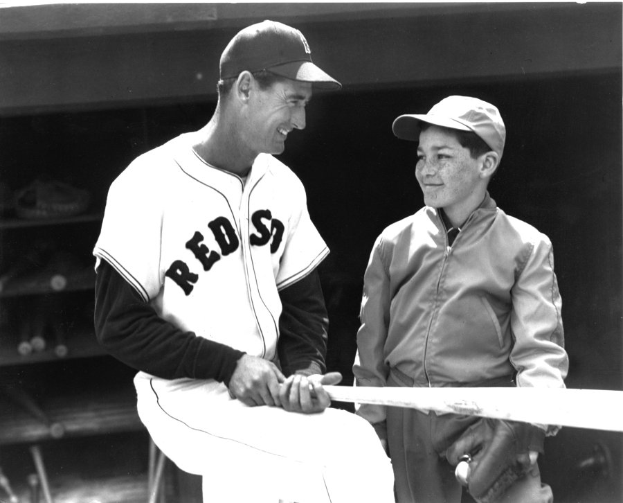 Black and white photo of Ted Williams with a patient