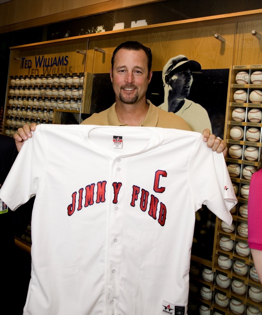 Tim Wakefield holding a Jimmy Fund jersey
