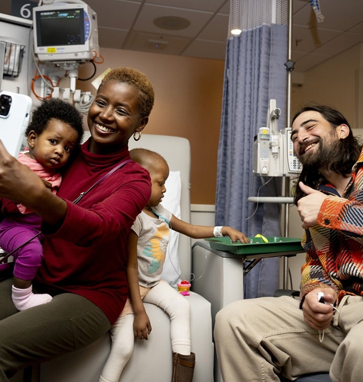 Patient sits with family in doctor's office