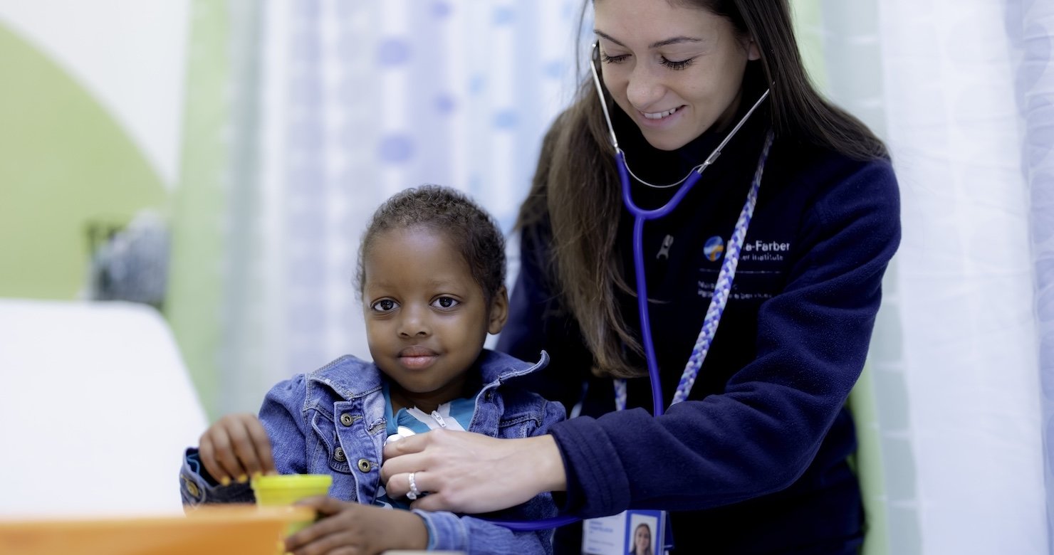 A Dana-Farber caregiver with a patient