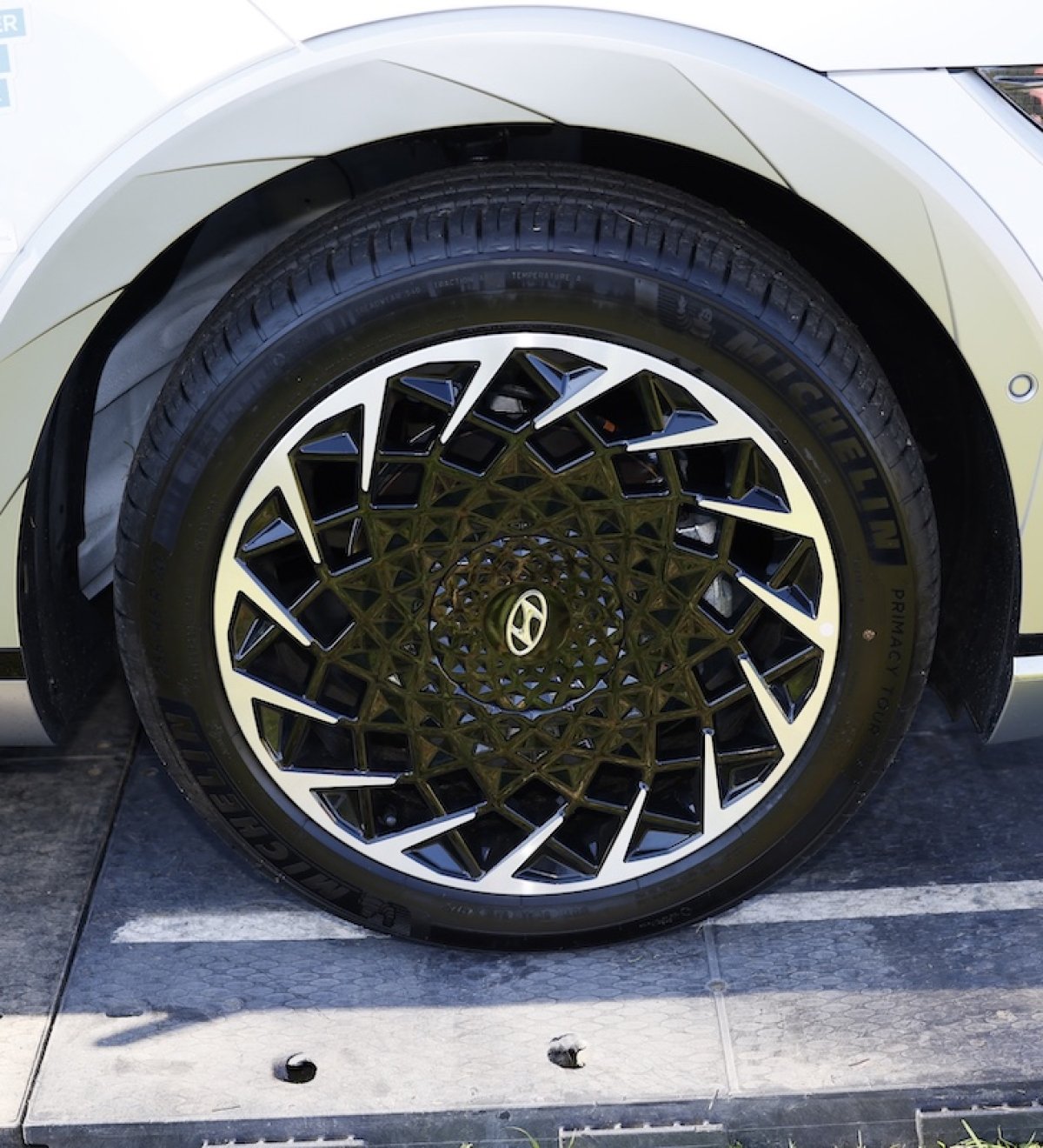 Close-up of a Hyundai tire and car with Jimmy Fund stickers on it