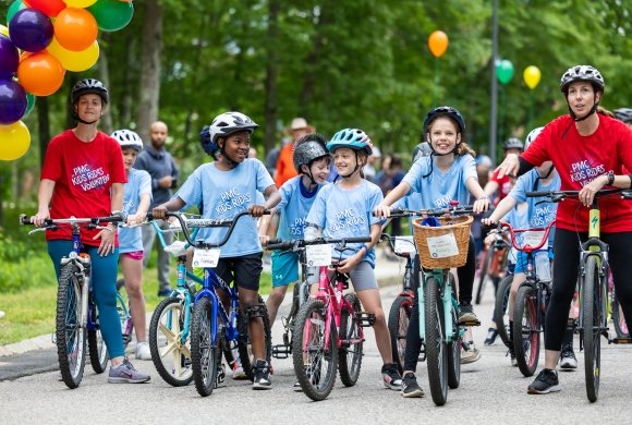 Group of youth riders at start line of a PMC Kids Ride