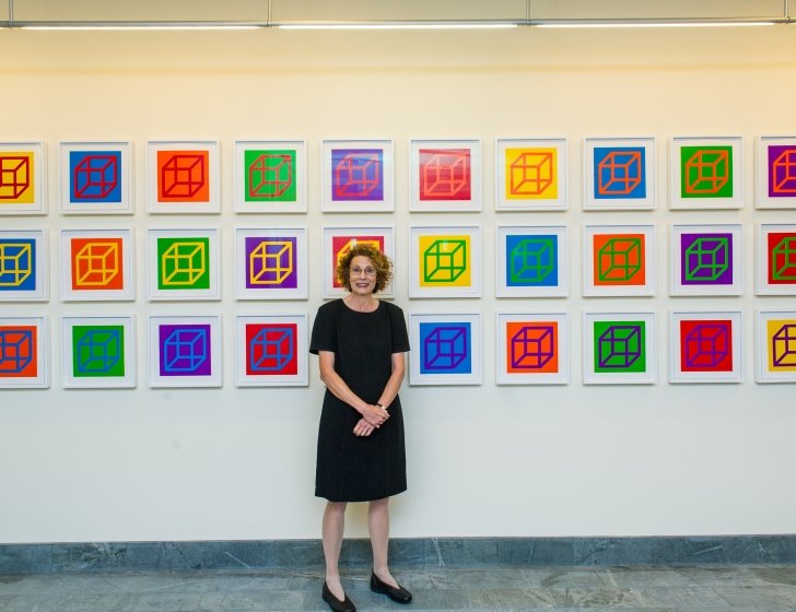 Dana-Farber's art curator Elaine standing in front of art