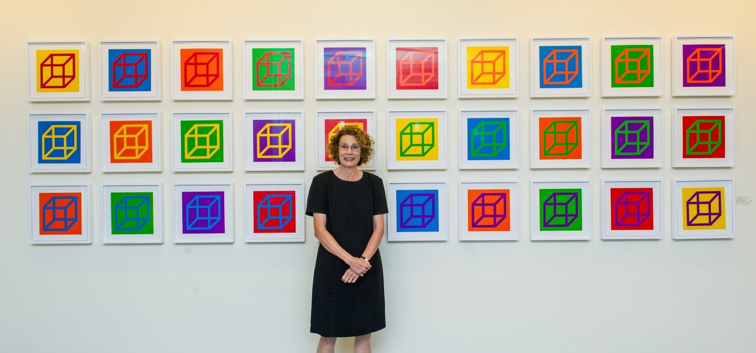 Dana-Farber's art curator Elaine standing in front of art
