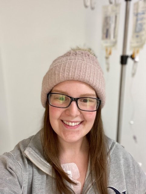Natalie smiles while receiving treatment