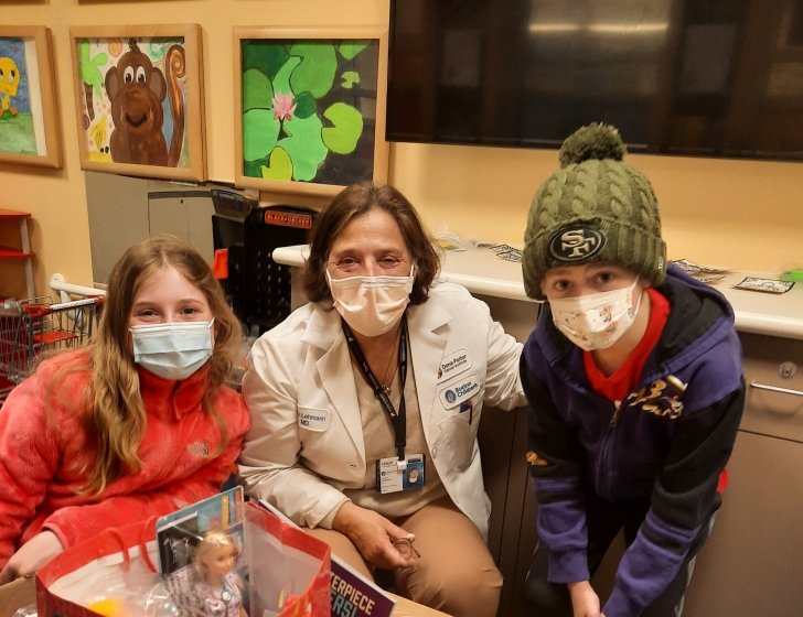 Keene and Heeth stand together with a doctor