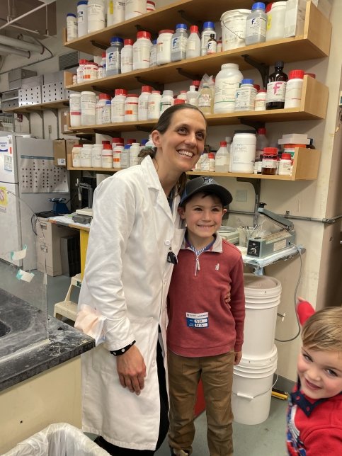 Patient and Dr. Nina stand in a lab hugging