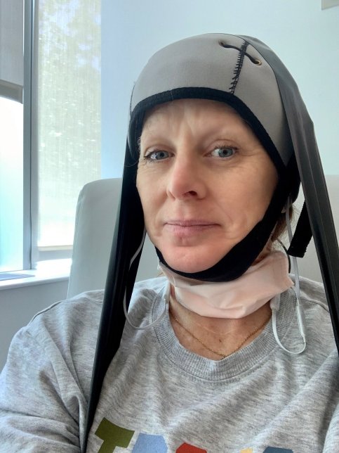 Michelle wearing mask and headcap