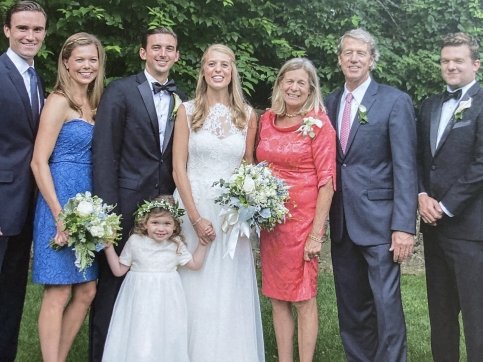 Family poses together at wedding