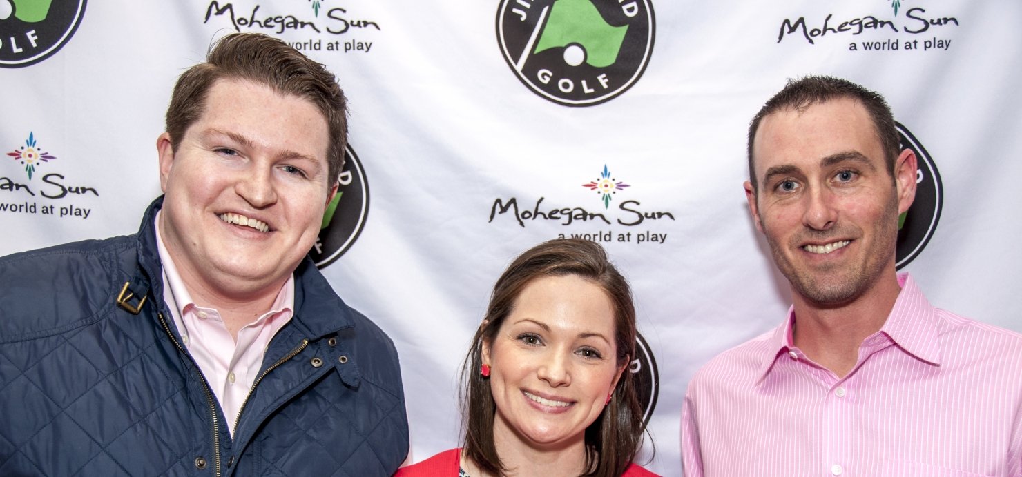 Three people in front of a Jimmy Fund Golf backdrop