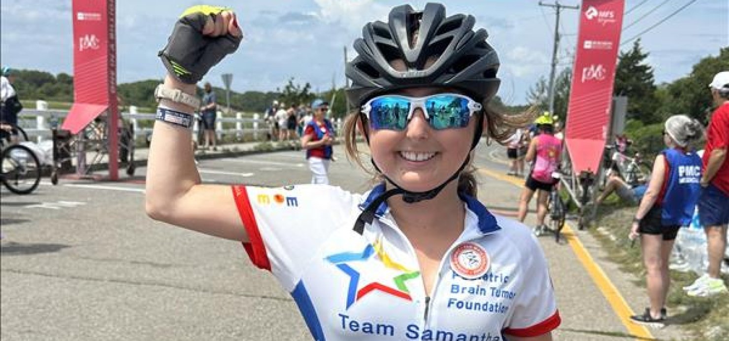 Samantha with a bike on the PMC route