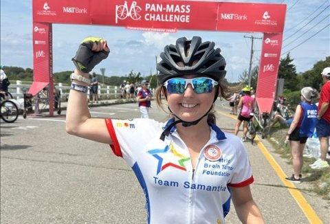 Samantha with a bike on the PMC route