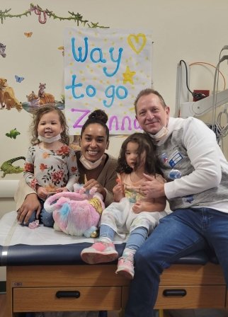 Zanna and family sit together in doctor’s office