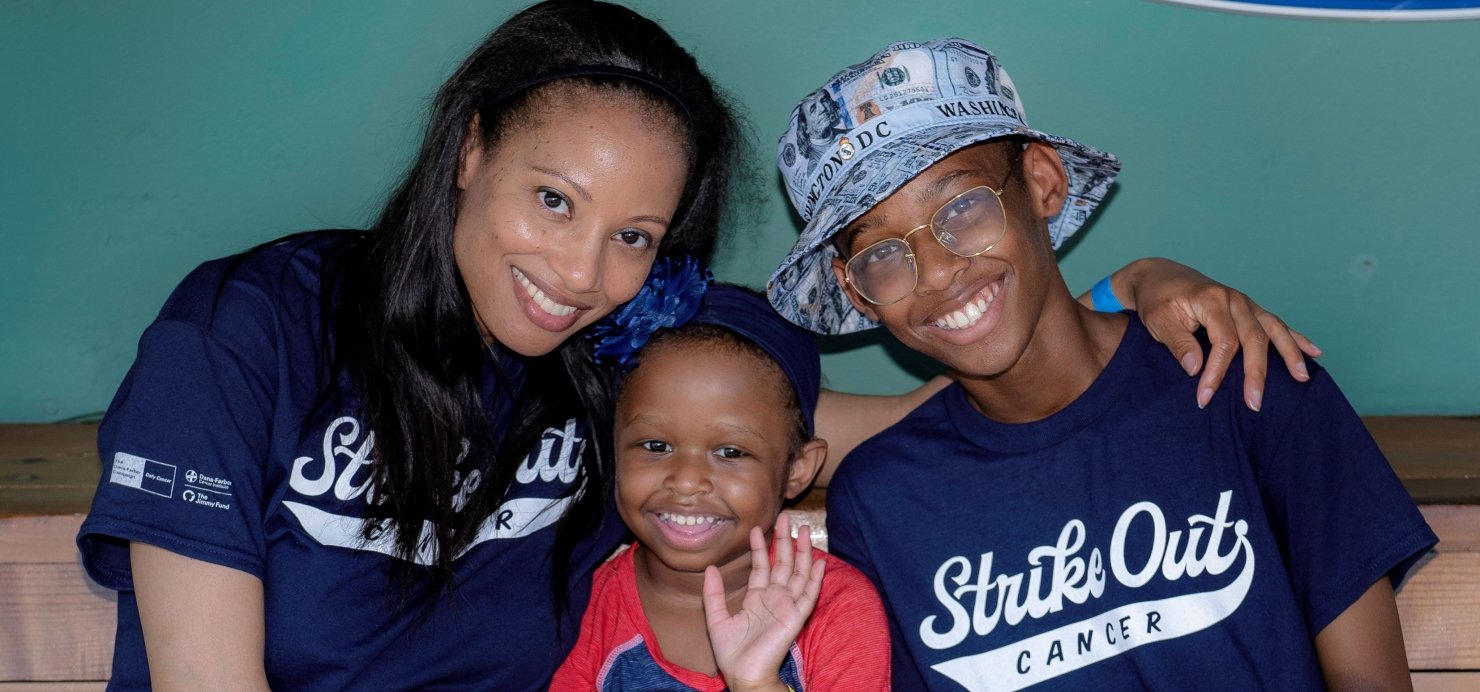 Family sits in Fenway Park dugout wearing 'Strike Out Cancer' T-shirts