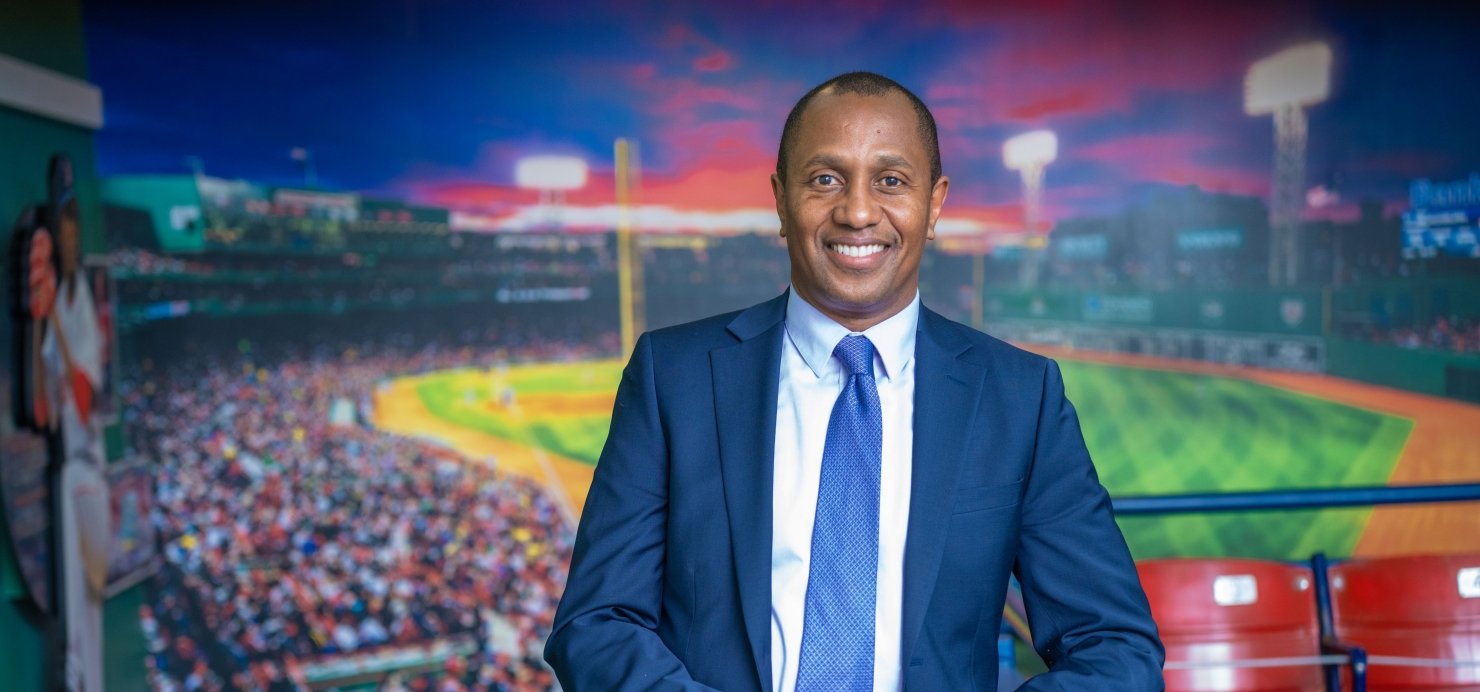 Ian Matthew-Clayton in front of a Fenway Park image