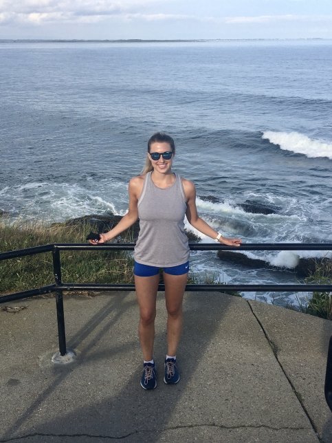 Kelly on the beach taking a break from a run