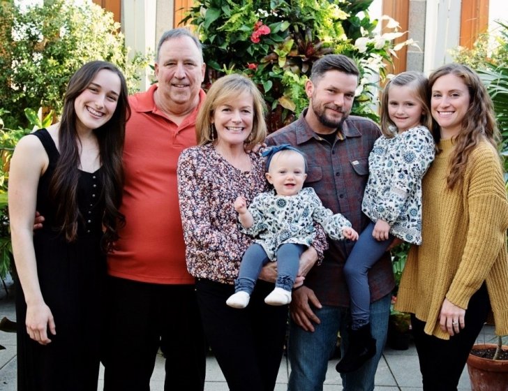 Patient and family pose together