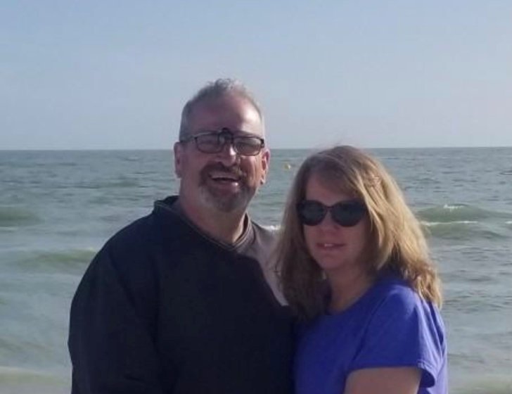 Steve with his wife on the beach