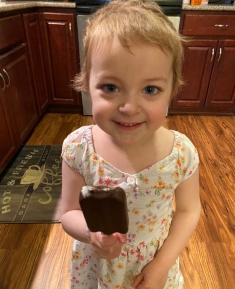 Avery holds an ice cream bar