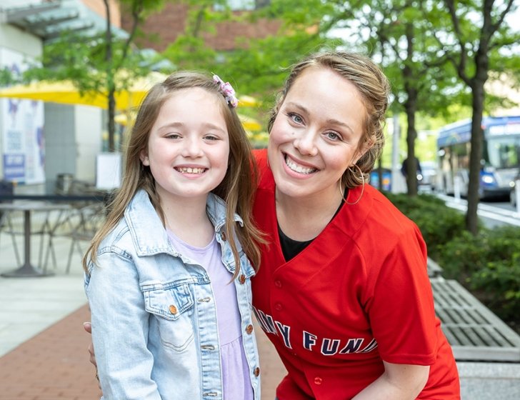 Mom in a Jimmy Fund jersey with her daughter 