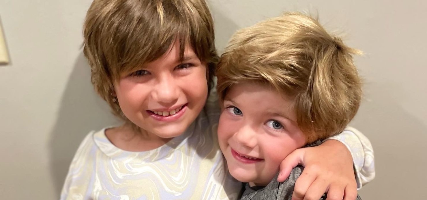 Chloe and her brother hugging