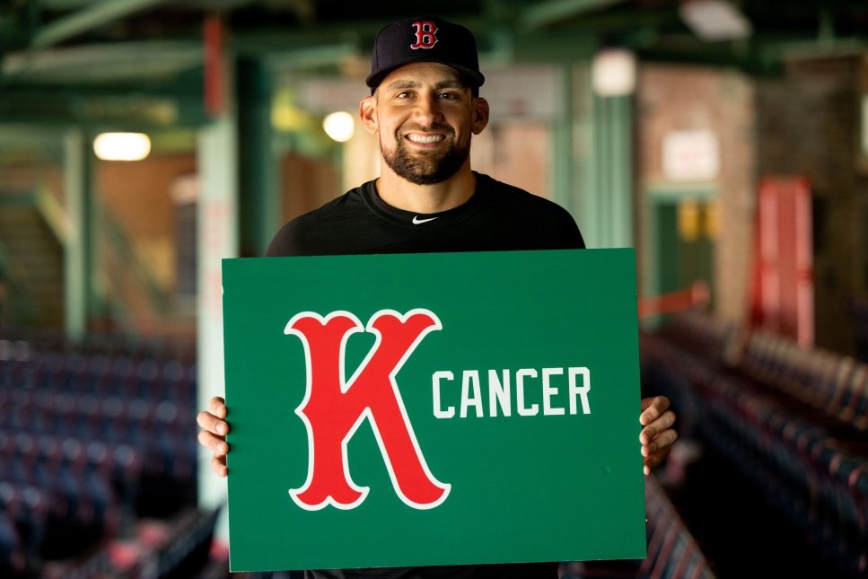 Nathan Eovaldi holding a K Cancer sign
