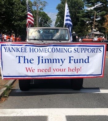A sign on a car that reads ‘Yankee Homecoming Supports the Jimmy Fund, we need your help!’