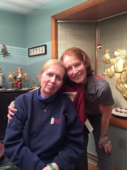 Cindy and sister hug in living room