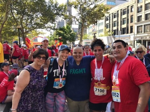 Patient and four family members hug during the Jimmy Fund Walk
