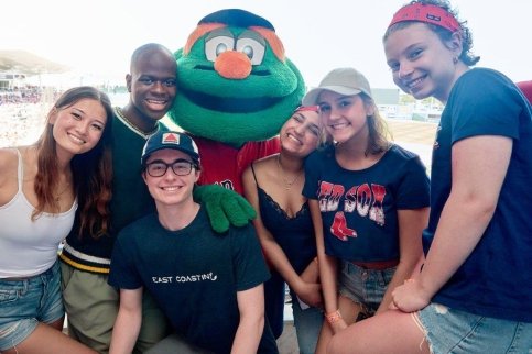 Six teenagers pose with Wally, the Red Sox mascot