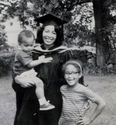 Black and white photo of Patti standing outside with her mother and brother in 1967