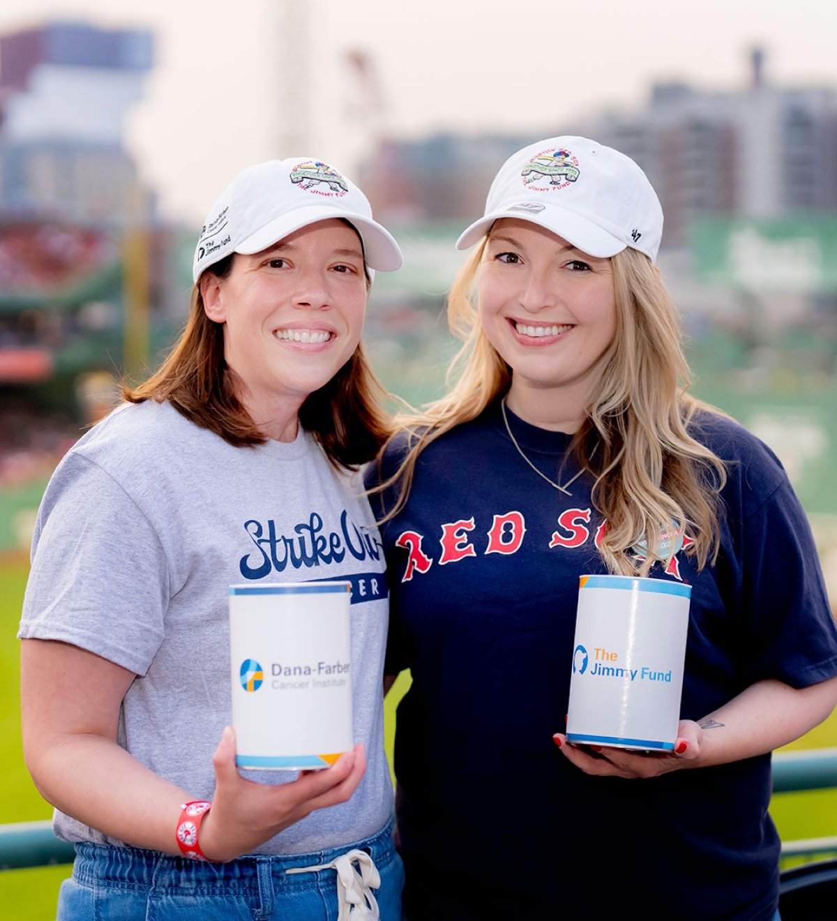 Two volunteers at a past Radio-Telethon with collection cans