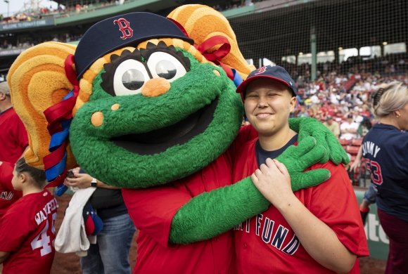 Boston Red Sox mascot Tessie at Fenway Park with a Dana-Farber patient wearing a Jimmy Fund shirt