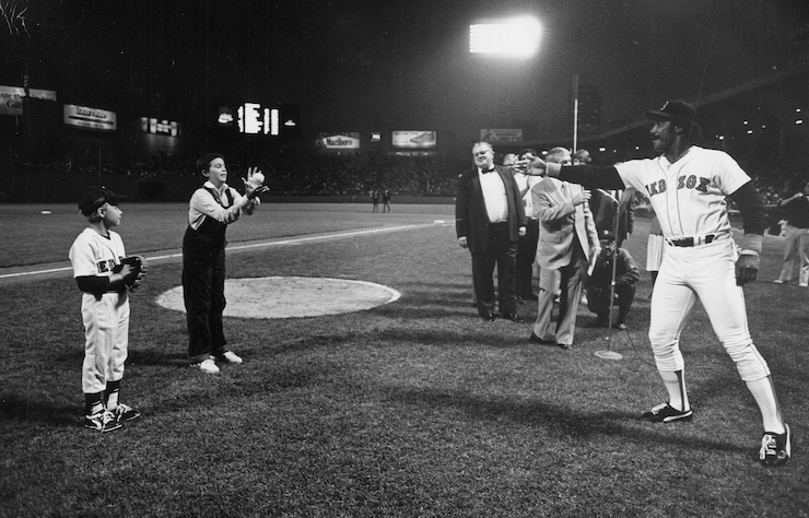 Black and white photo of Jim Rice playing catch with kids