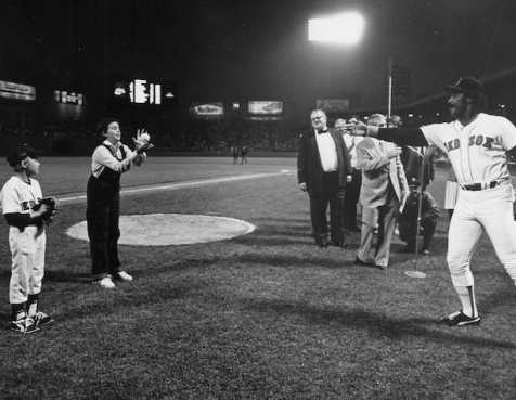 Black and white photo of Jim Rice playing catch with kids