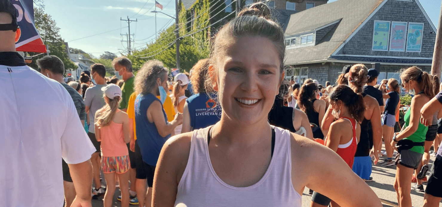 Natalie stands with a crowd of runners at the Falmouth Road Race
