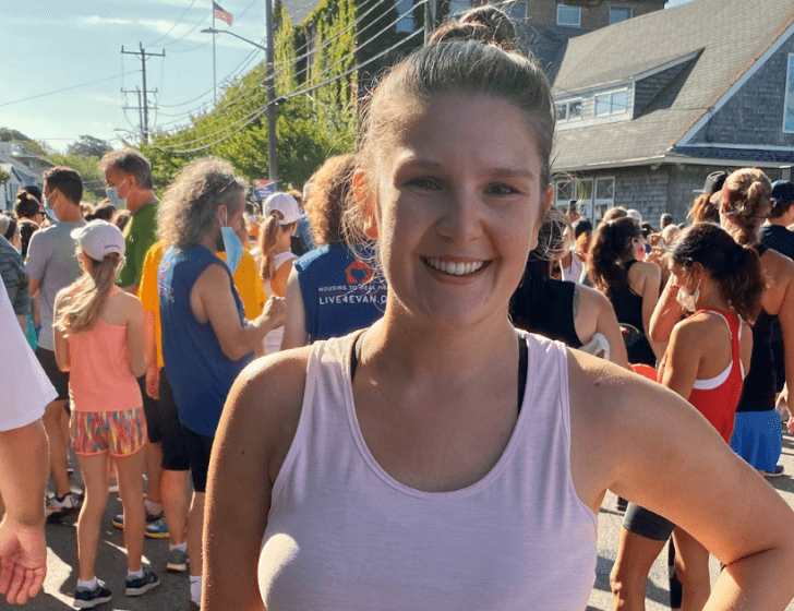 Natalie stands with a crowd of runners at the Falmouth Road Race