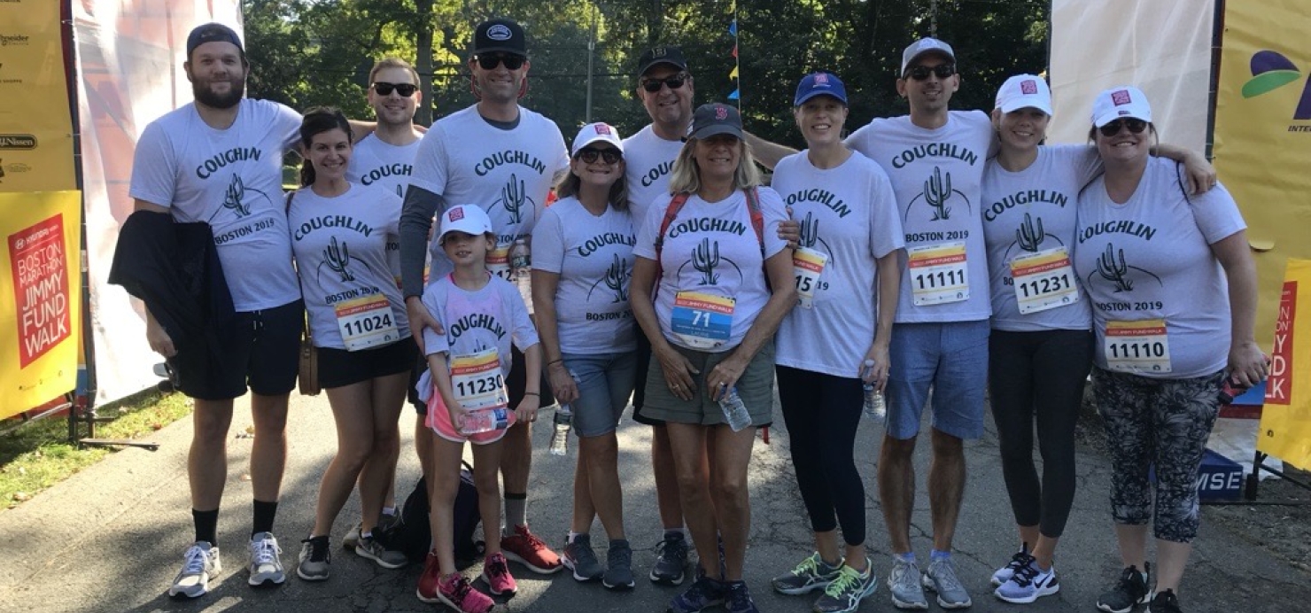 Coughlin family stands in front of Jimmy Fund Walk Newton Start Line